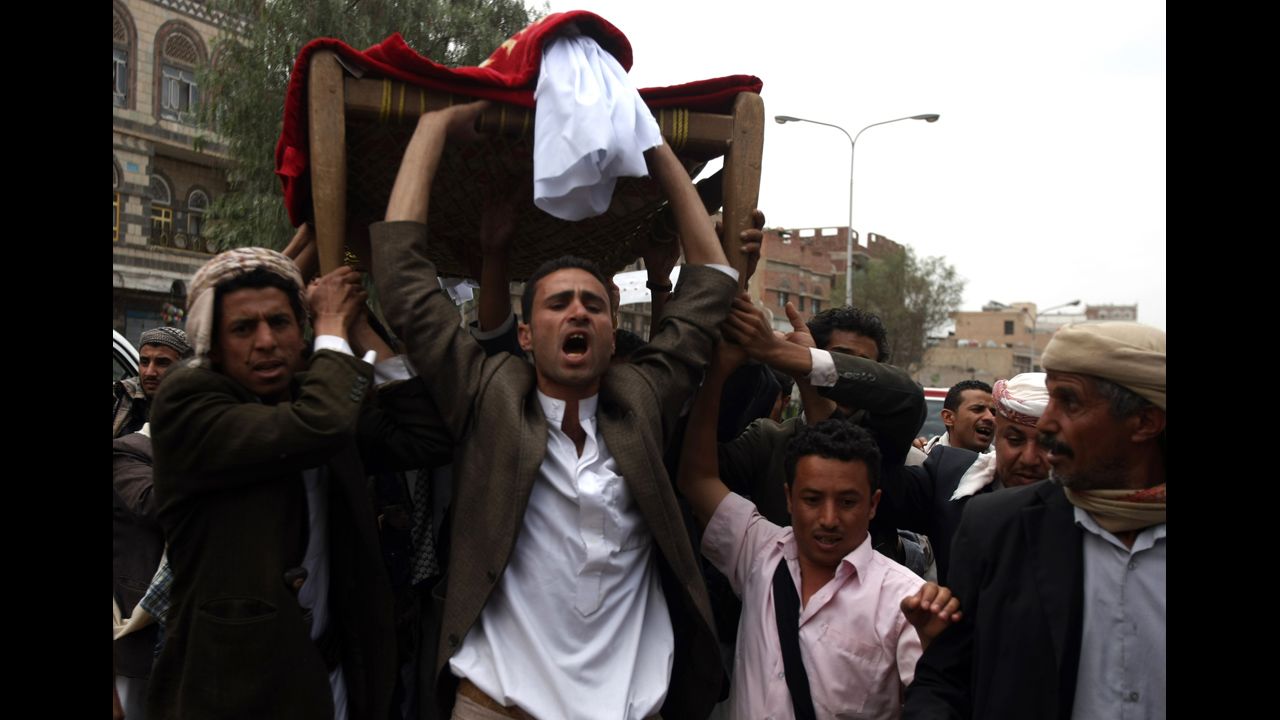 Mourners shout slogans during the funeral of a protester who was killed two days ago during clashes with security forces at the U.S. Embassy in Sanaa, Yemen, on Saturday . According to media reports, at least four people were killed when hundreds of Yemeni protesters stormed the embassy on Wednesday.
