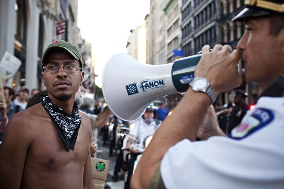 A police officer gives orders to Occupy Wall Street protesters on Saturday.