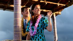 Britain's Prince William and his wife Catherine, the Duchess of Cambridge, wave to the local Solomon Islanders as they leave the airport aboard a truck decorated as a canoe in Honiara on Sunday, September 16.