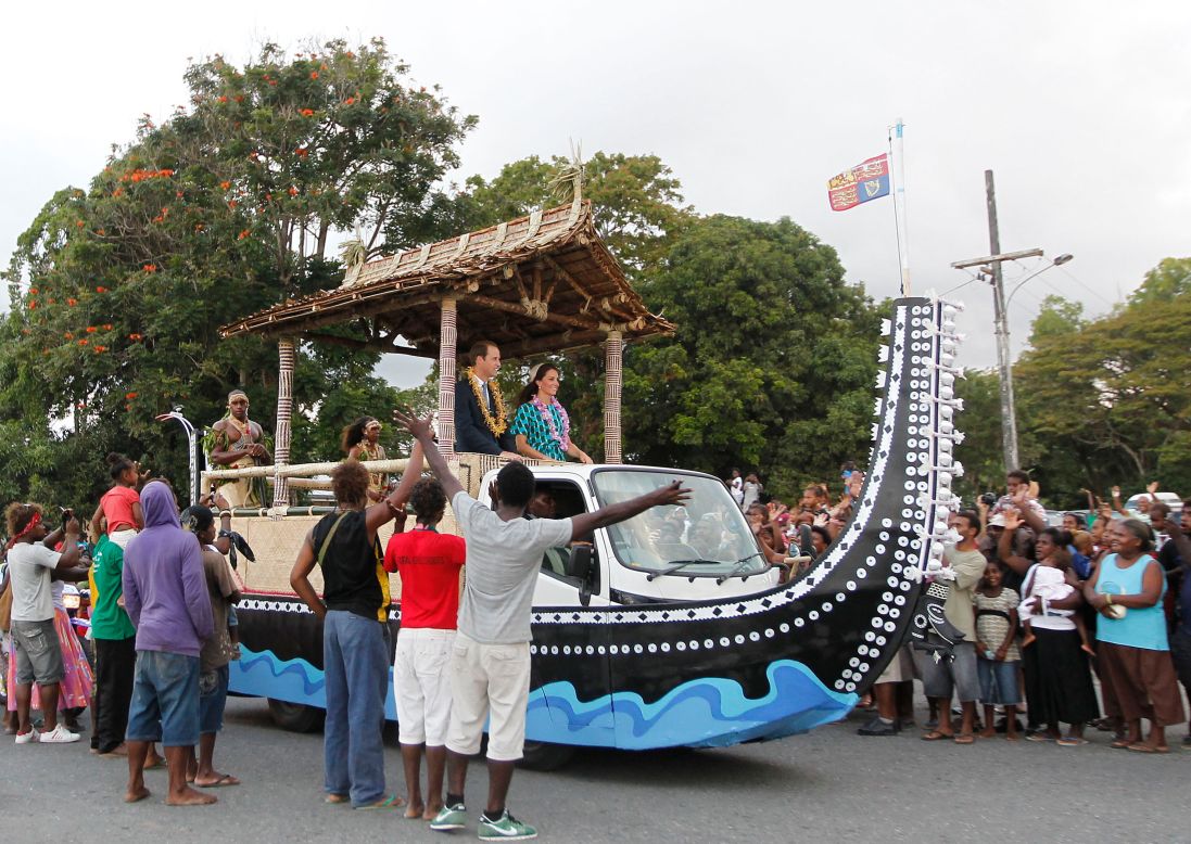 Britain's Prince William and his wife, Catherine, Duchess of Cambridge, are greeted by Solomon Islanders on Sunday.