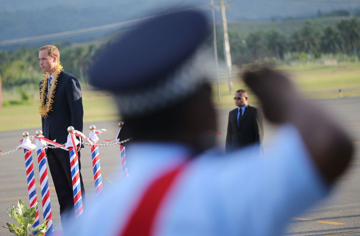 Prince William, Duke of Cambridge, inspects an honor guard as he arrives at Honiara International Airport in the Solomon Islands on Sunday, September 16.