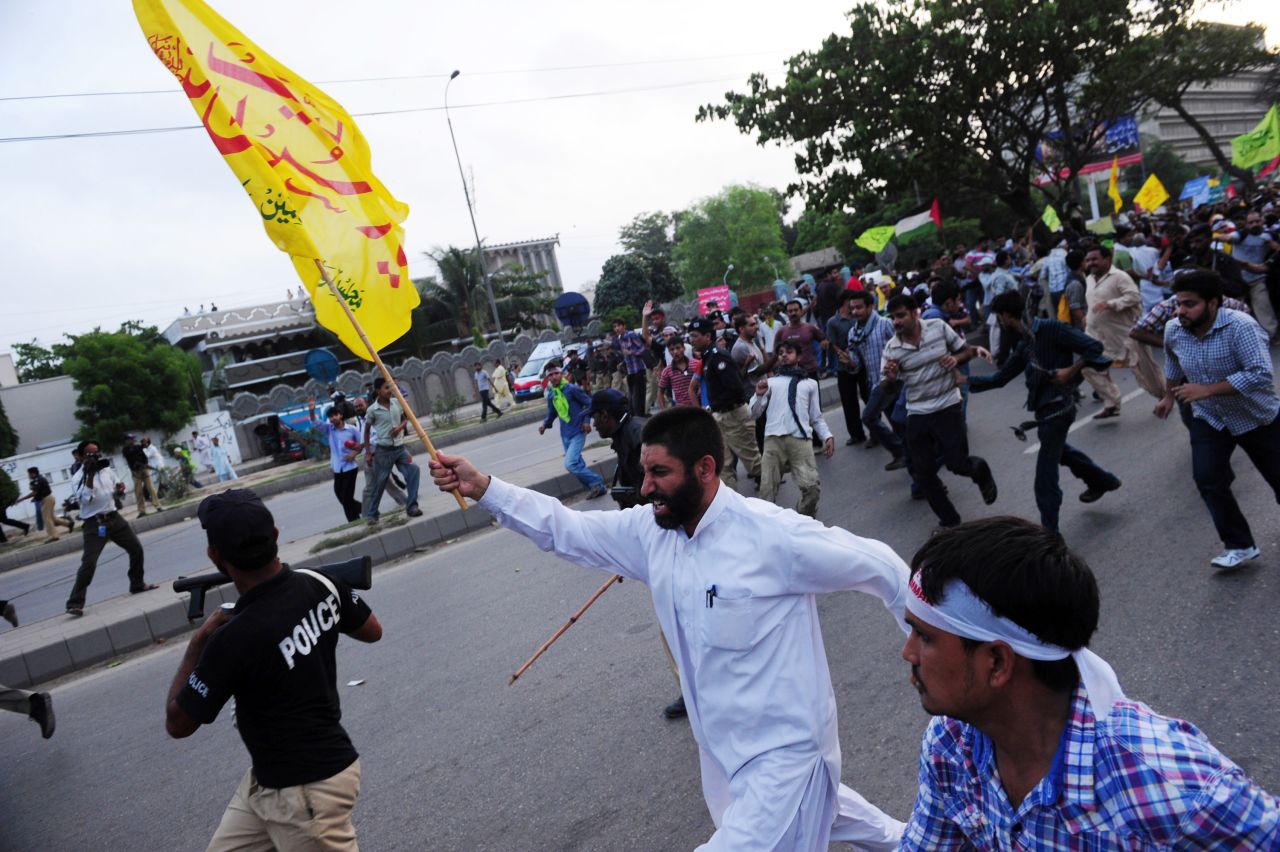 Pakistani protesters march toward the U.S. Consulate in Karachi on Sunday.