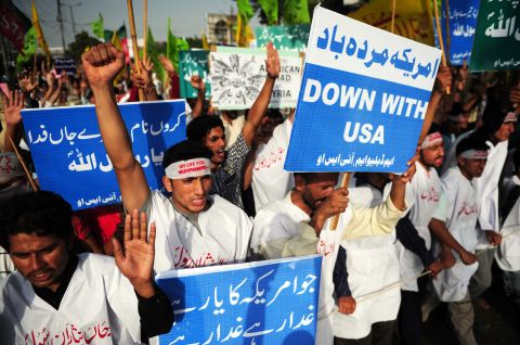 Pakistani protestors hold banners and shout anti-U.S. slogans in Karachi on Sunday.