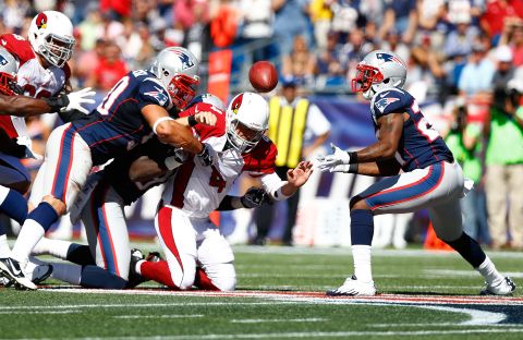 Quarterback Kevin Kolb of the Arizona Cardinals fumbles the ball into the hands of Mike Adams of the New England Patriots during the game on Sunday.