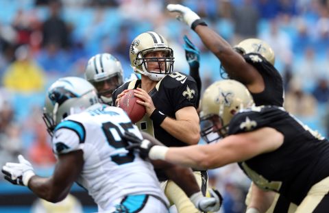 Quarterback Drew Brees of the New Orleans Saints looks to pass against the Carolina Panthers on Sunday.