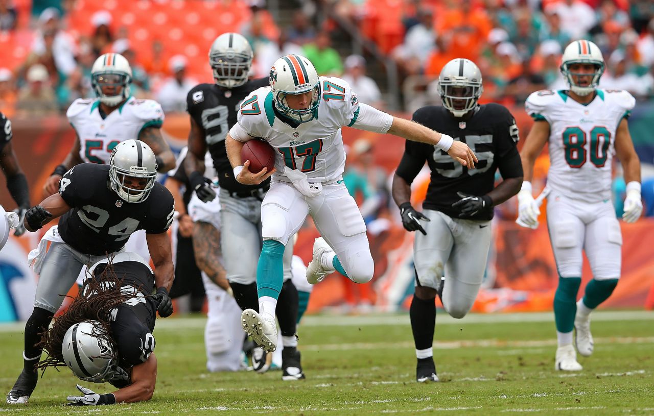 Ryan Tannehill of the Miami Dolphins rushes during a game Sunday against the Oakland Raiders.