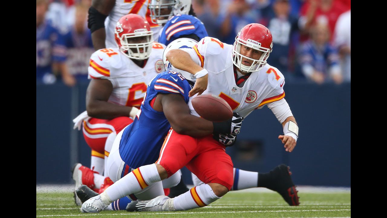 Quarterback Matt Cassel of the Kansas City Chiefs fumbles the ball after being tackled by Alex Carrington of the Buffalo Bills on Sunday.