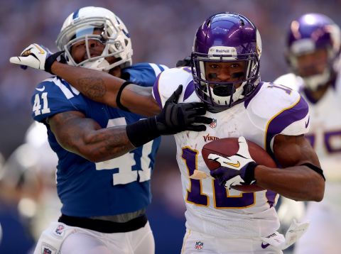Wide receiver Percy Harvin of the Minnesota Vikings runs the ball while being defended by Antoine Bethea of the Indianapolis Colts on Sunday.