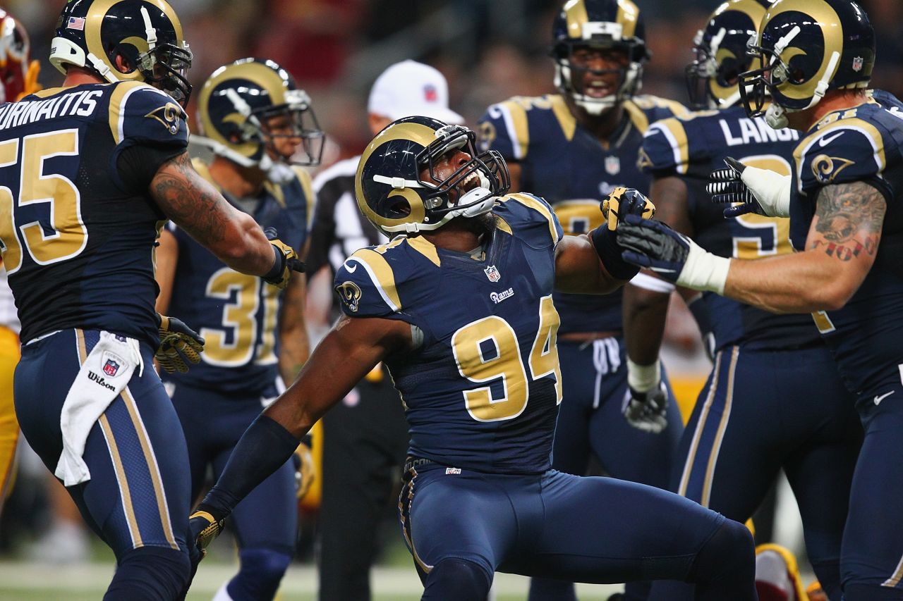 Robert Quinn of the St. Louis Rams, center, celebrates a sack against the Washington Redskins on Sunday.