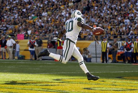Santonio Holmes of the New York Jets celebrates his touchdown in the first half Sunday against the Pittsburgh Steelers.