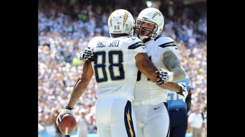 Nick Hardwick of the San Diego Chargers, right, reacts to Dante Rosario's touchdown Sunday against Tennessee Titans.