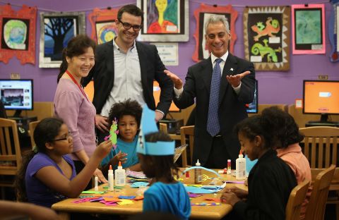 Chicago Mayor Rahm Emanuel, right, visits schoolchildren at Woodson Regional Library on Monday. The library is one of 78 public libraries in the city serving as "safe havens" for students who are not in school because of the strike.