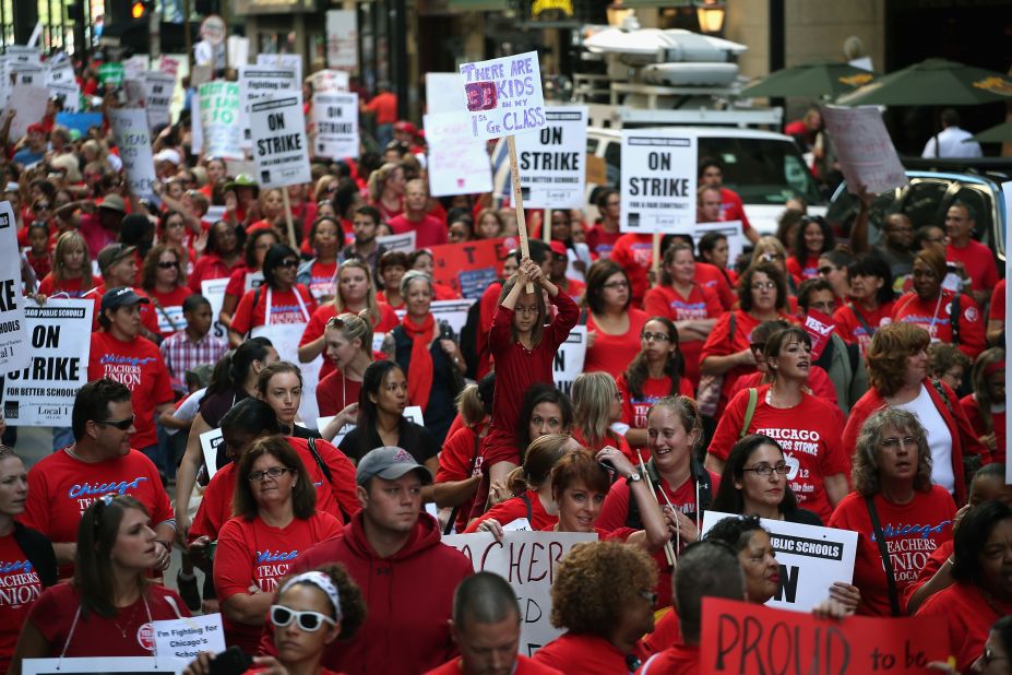 Thousands of teachers and their supporters march in front of the Chicago Public Schools headquarters on Monday. With more than 350,000 students, Chicago is home to the nation's third-largest school system.