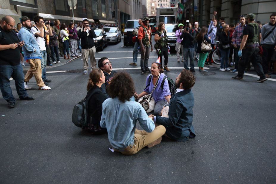 Protesters block a street near Wall Street during the one-year anniversary of the Occupy Wall Street movement on Monday.