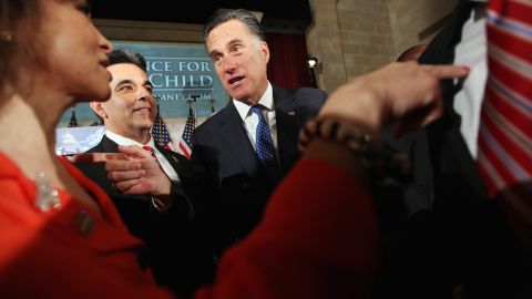 Mitt Romney and Hector Barreto Jr., chairman of the Latino Coalition, greet guests at the U.S. Chamber of Commerce in Washington in May.