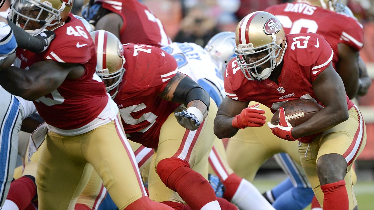 Frank Gore of the San Francisco 49ers carries the ball for a one-yard touchdown run in the second quarter against the Detroit Lions on Sunday, September 16, at Candlestick Park in San Francisco.