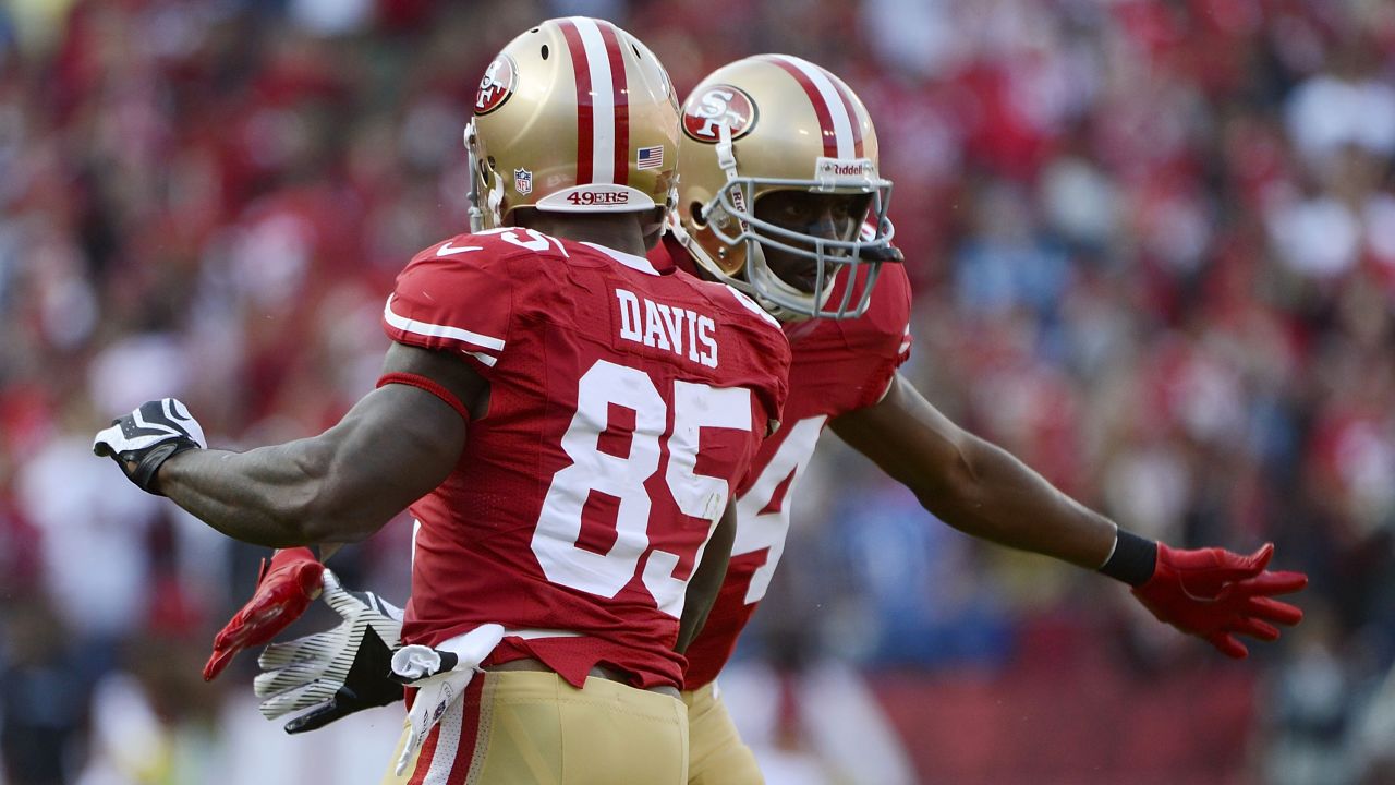 Vernon Davis and Randy Moss of the San Francisco 49ers celebrate Sunday after Davis caught a 21-yard touchdown pass against the Detroit Lions.