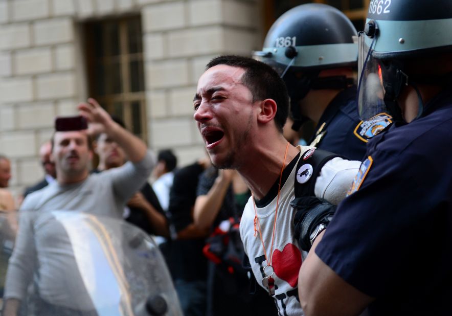 A participant in the Occupy Wall Street protest is arrested during a rally to mark the one-year anniversary of the movement in New York on Monday, September 17, 2012. 