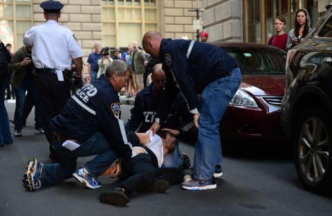 An Occupy Wall Street participant is arrested by police on Monday.