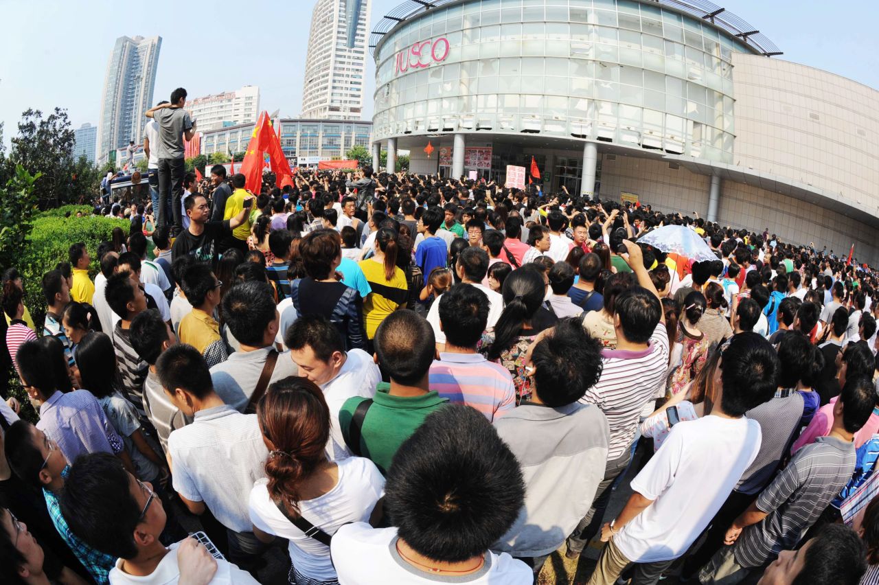 Chinese protesters gather outside a JUSCO, a Japanese department store, in Qingdao, northeast China's Shandong province. 