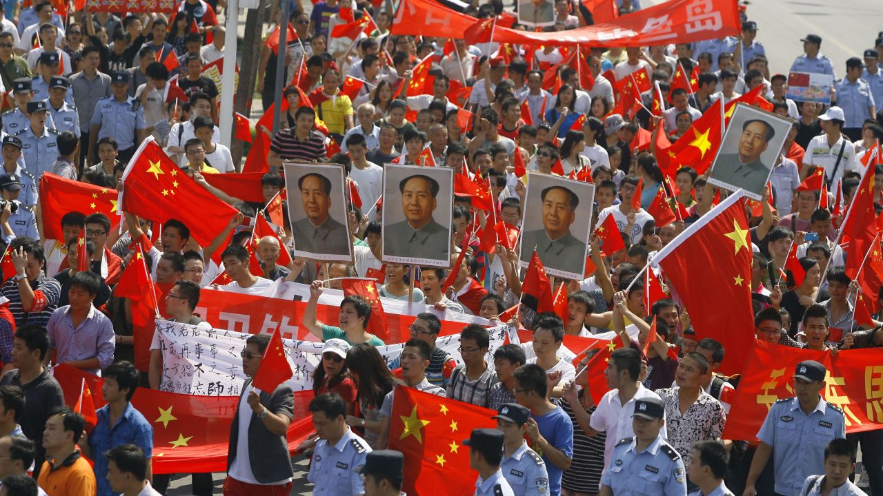 Chinese demonstrators carry anti-Japan banners and shout slogans on September 16.