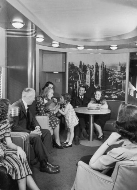 Passengers circa 1930 enjoy the observation car on the new streamlined 20th Century Limited shown here, with luxury service between New York and Chicago. 