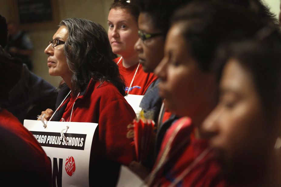Striking teachers attend a news conference by the Chicago Teachers Solidarity Campaign outside the office of Mayor Rahm Emanuel in Chicago on Monday, September 17. Emanuel sought court action to force teachers back to work.