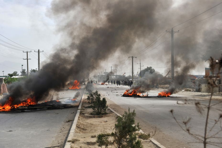 Barricades of tires burn Monday in Kabul. 
