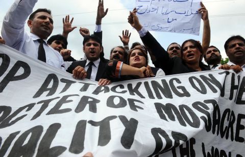 Pakistani lawyers shout anti-American slogans as they march Monday in Lahore.