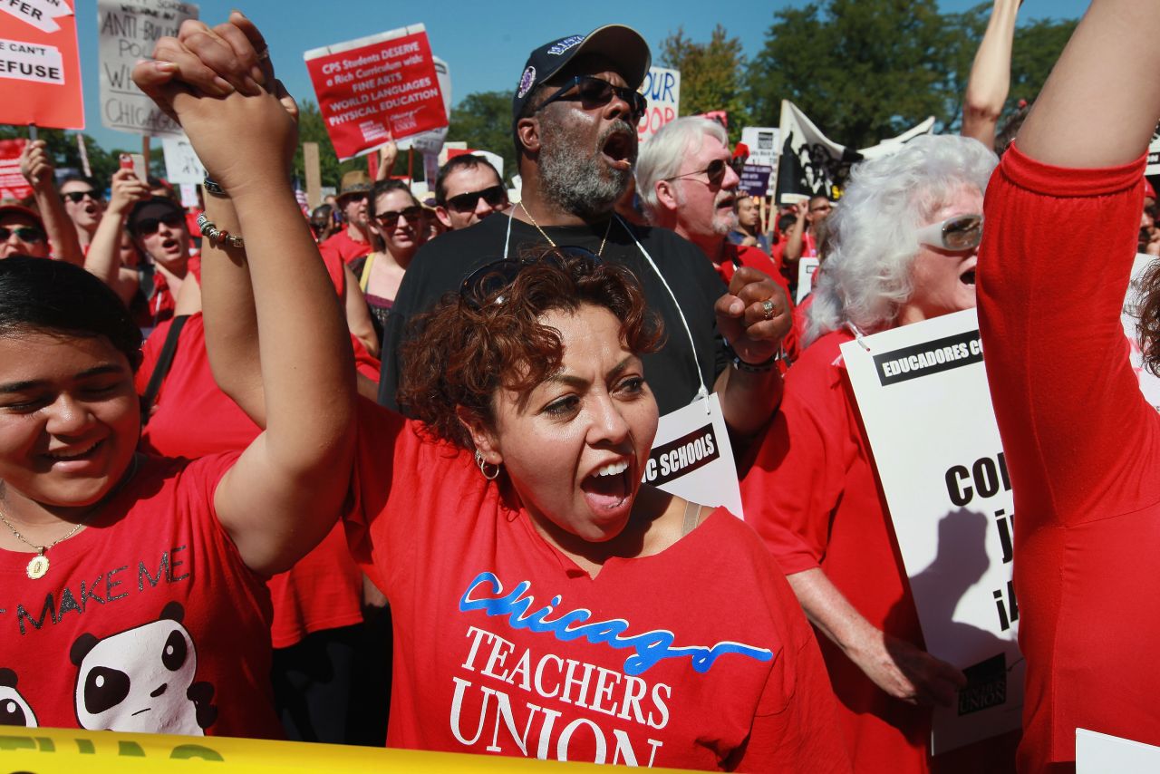 Chicago teachers and their supporters attend a rally at Union Park on Saturday, September 15. An estimated 25,000 people gathered in the park in a show of solidarity.