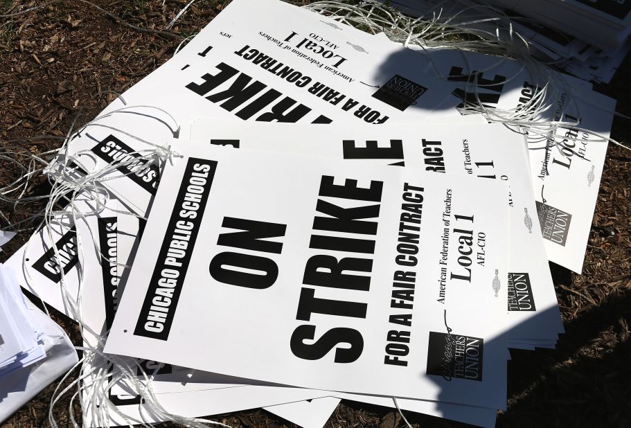 Strike posters are left on the ground in Union Park on Saturday. More than 26,000 teachers and support staff walked off their jobs on September 10 after the union failed to reach an agreement with the city on compensation, benefits and job security.