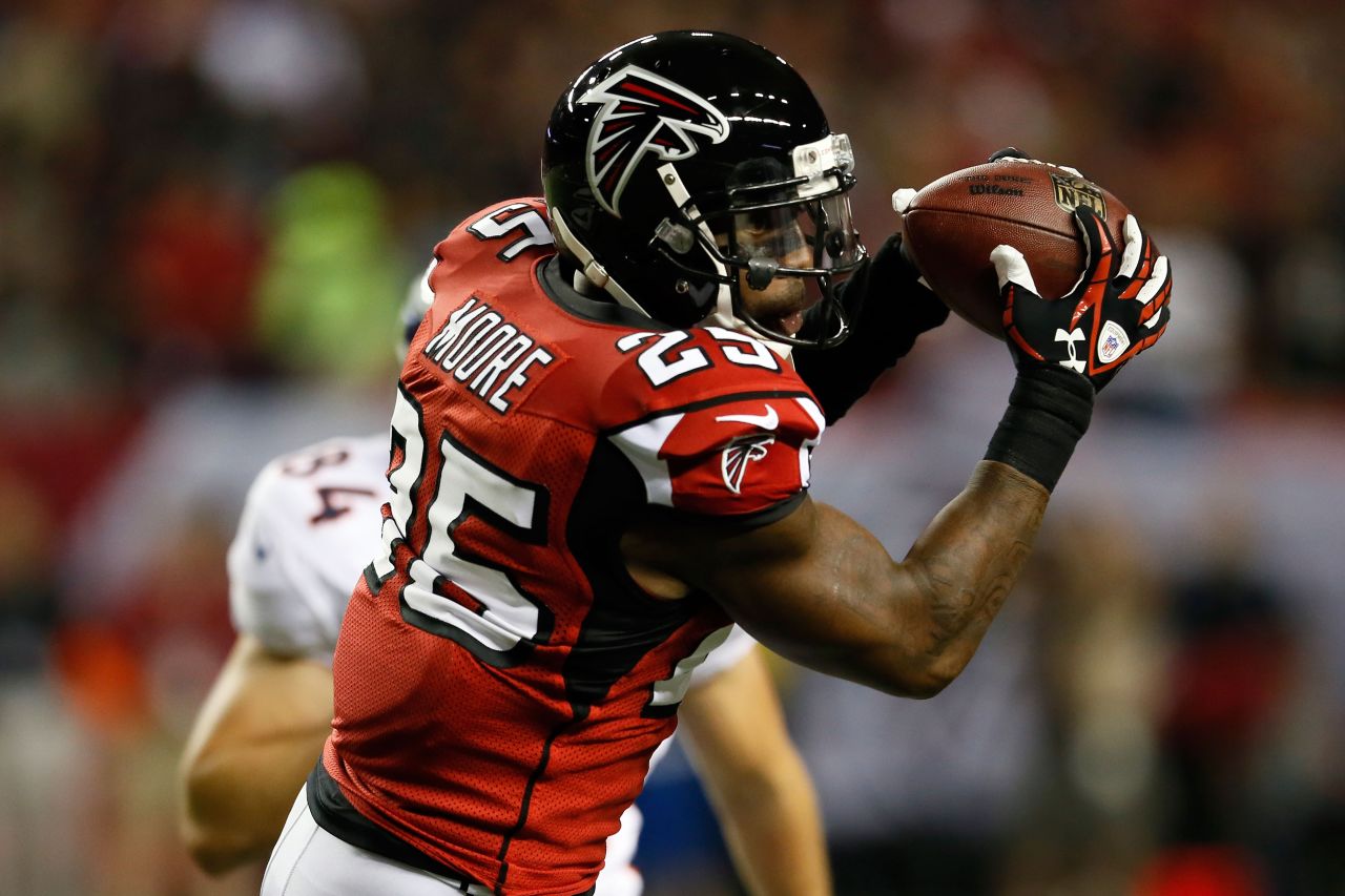 William Moore of the Atlanta Falcons intercepts a pass intended for Jacob Tamme of the Denver Broncos on Monday. Broncos quarterback Peyton Manning threw three interceptions in the first quarter.