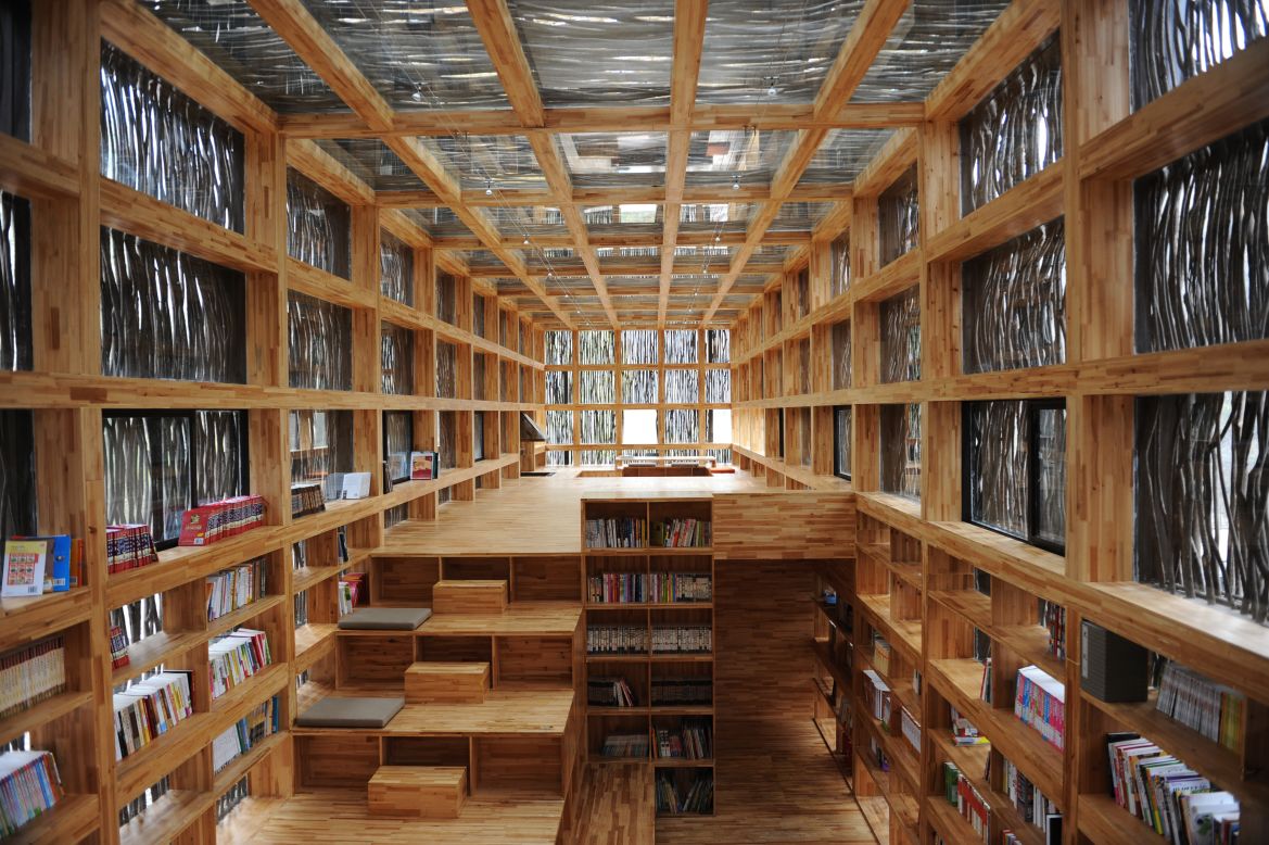 Located on the outskirts of Beijing, the single-storey Liyuan Library is cloaked in firewood so as to blend in with the surrounding tree life.<br /><em>Designed by: Li Xiaodong, China</em>