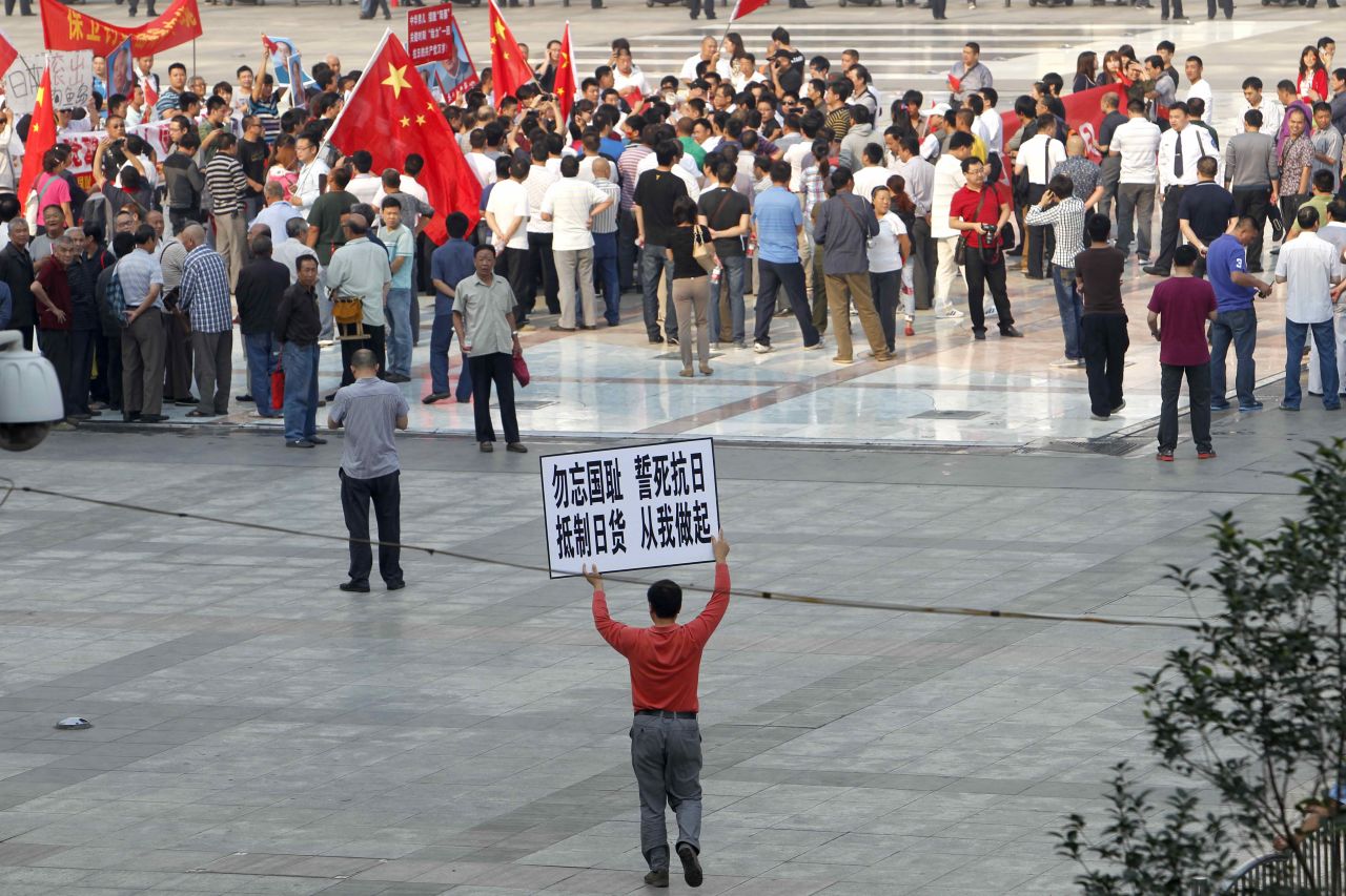 Chinese demonstrators protest on the streets in Zhengzhou, Henan province, on September 18, carrying on anti-Japanese rallies from the weekend.