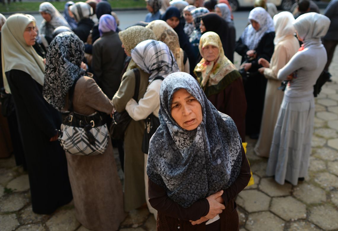 Women in Pazardjik, Bulgaria, stand outside the court, where 13 Bulgarian Muslims, including several  imams, are on trial, suspected of belonging to the Saudi-based Islamic foundation Alwaqf Alislami and charged with spreading religious hatred and preaching anti-democratic ideology.  