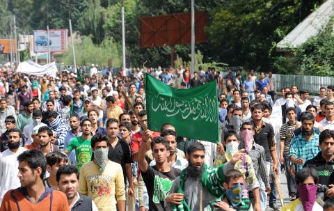 Kashmiri Muslim demonstrators shout anti-U.S. and Israeli slogans before a clash with Indian police  during a protest and one-day strike called by several religious and political organizations in Srinagar on Tuesday.