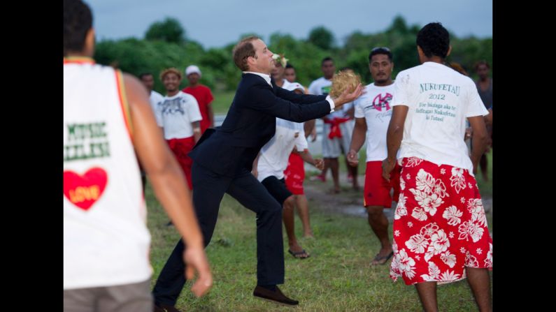 Prince William plays a local game called Te Ano on Tuesday, September 18, in Tuvalu. 