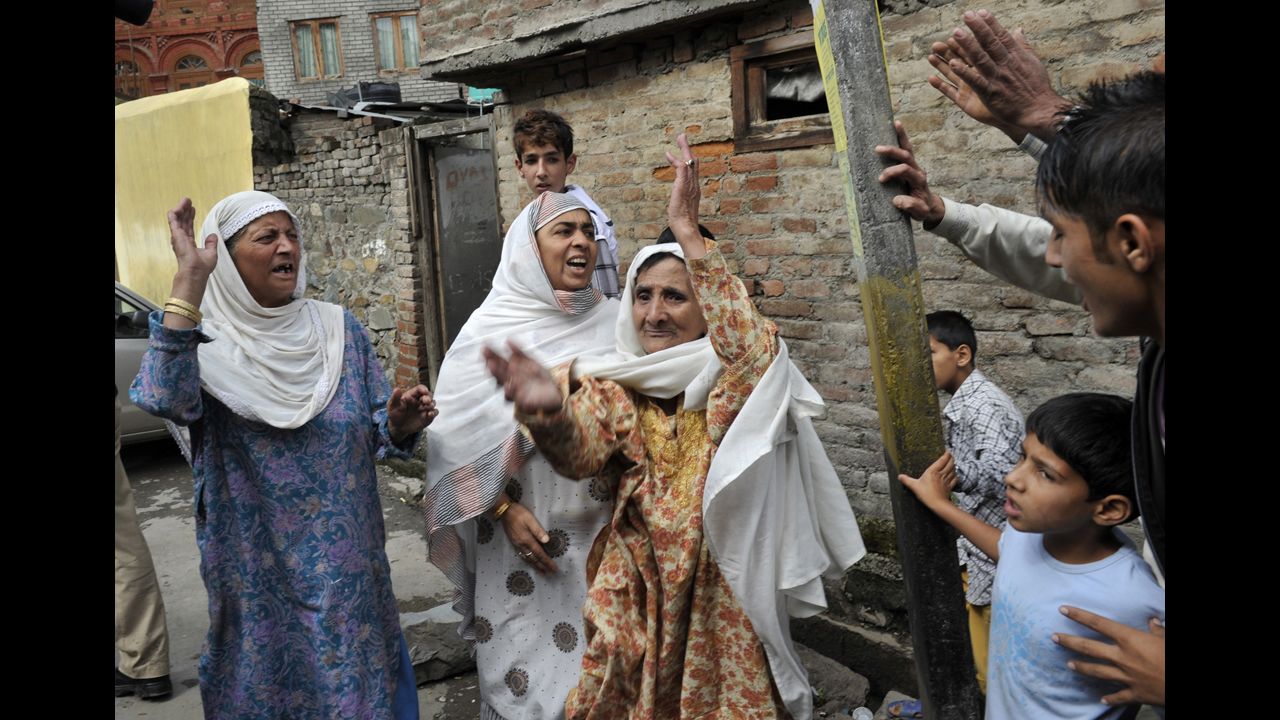 Muslim women shout Islamic slogans in Srinagar on Tuesday.