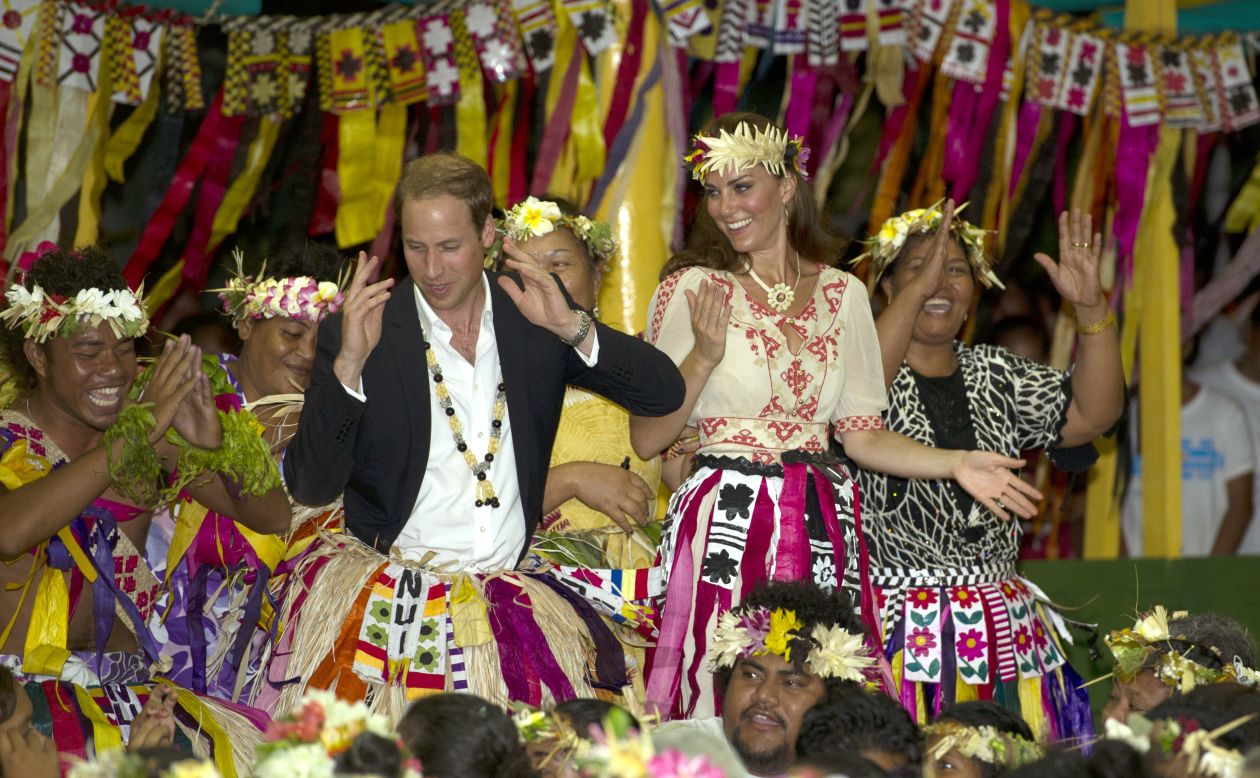 The duke and duchess dance with ladies at the Vaiku Falekaupule ceremony for an entertainment program on Tuesday in Tuvalu.