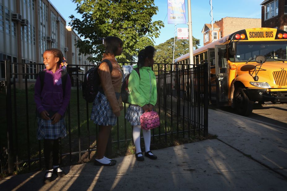 Students at Frazier International Magnet School wait outside before the start of classes Wednesday. Teachers and students had been out of school since the strike began on September 10.