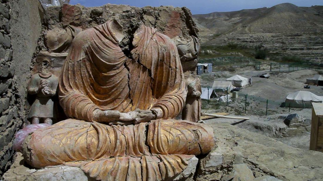 A Buddhist statue overlooks a Chinese government-owned mining compound in Logar province, Afghanistan. Mes Aynak, a 2,600-year-old Buddhist site, could be destroyed in December to create a massive copper mine.