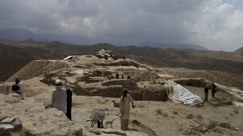 People work at one of the many archaeological excavation sites at Mes Aynak. In 2009, the mining company gave archaeologists three years to excavate the site.