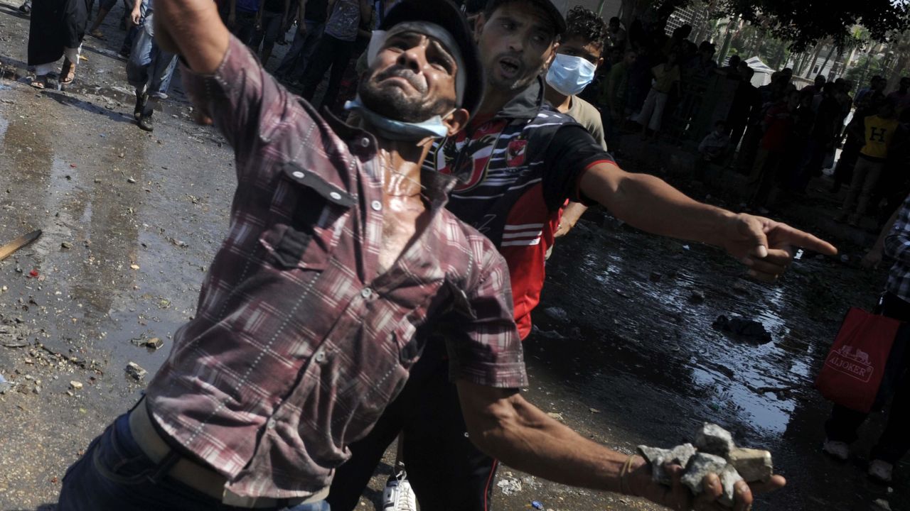 Protesters throw stones at police during clashes against an anti-Islam film near the U.S. Embassy in Cairo on Friday.
