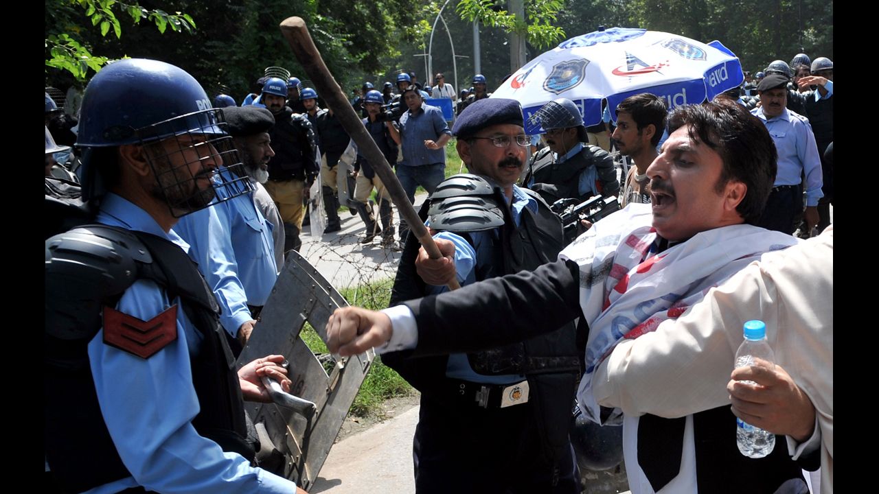 Pakistani riot policemen hold back lawyers shouting anti-U.S. slogans as they attempt to reach the U.S. Embassy  in Islamabad on Wednesday, September 19. More than 30 people have been killed around the world during more than a week of attacks and violent protests linked to a controversial film seen as insulting to the Prophet Mohammed.  