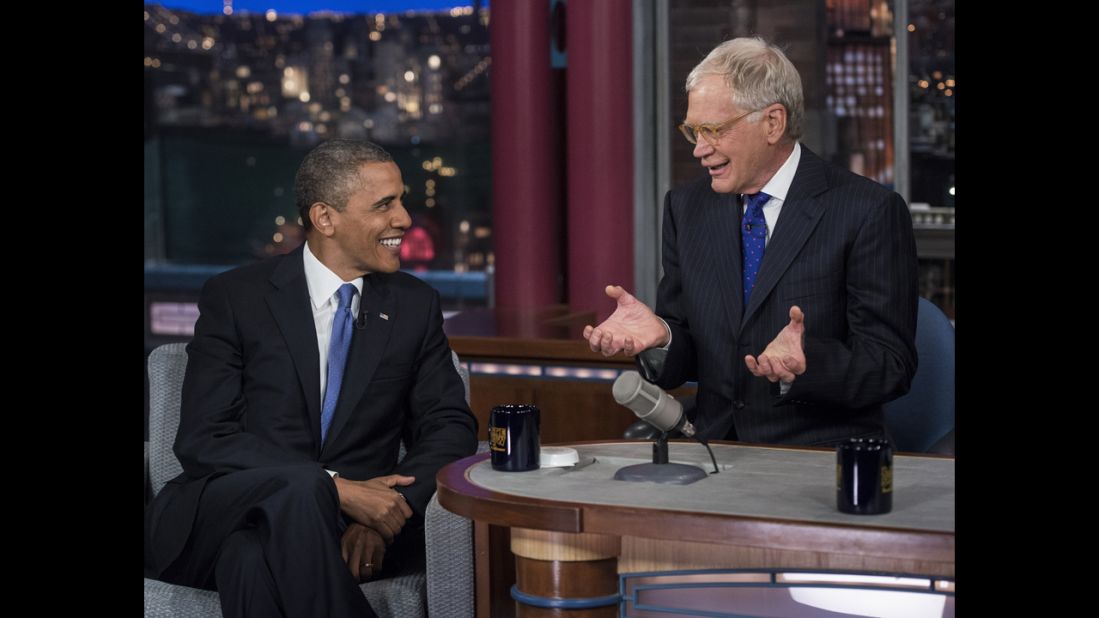 Obama and David Letterman speak during a break in the taping of the "Late Show with David Letterman" at the Ed Sullivan Theater on Tuesday in New York.