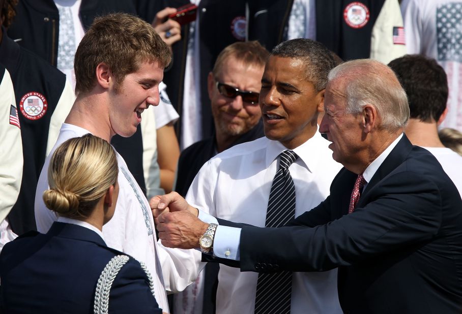 Olympic swimming silver medalist Jimmy Feigen, left, is greeted by Obama and Vice President Joe Biden on the South Lawn to welcome the 2012 U.S. Olympic and Paralympic teams on Friday.