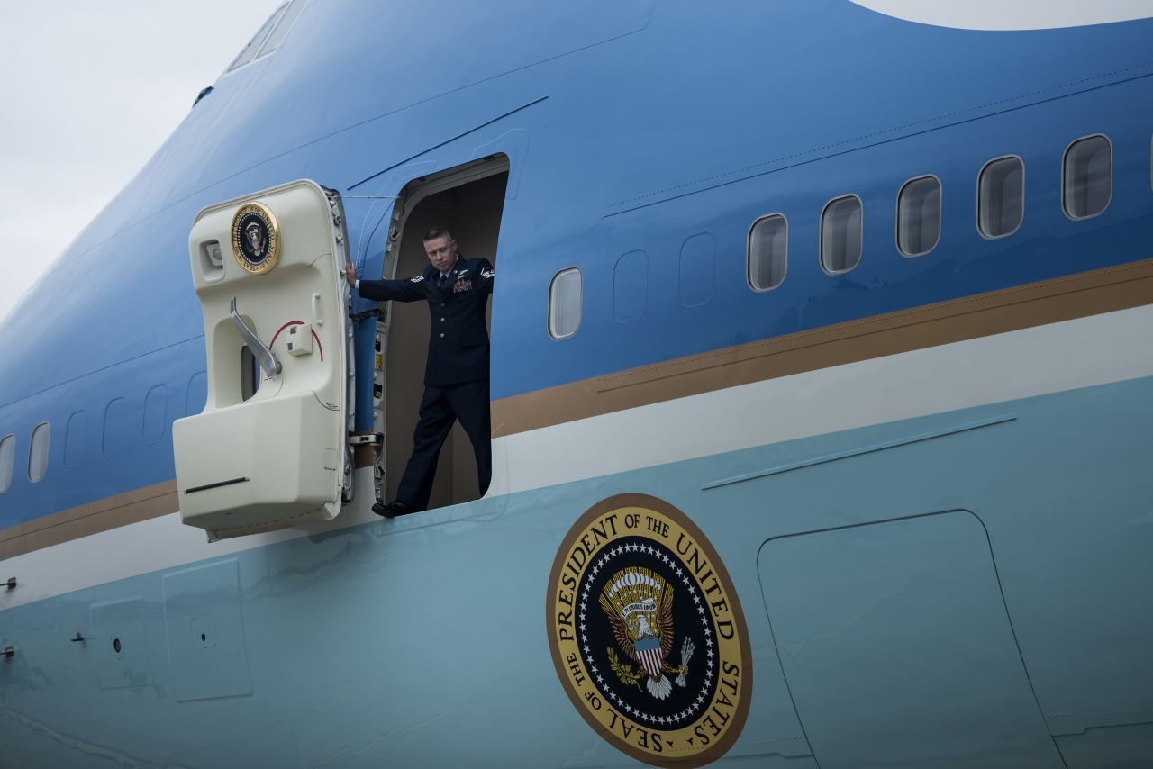 A crew member opens the door to Air Force One after the jet arrived at John F. Kennedy Airport in New York on Tuesday.