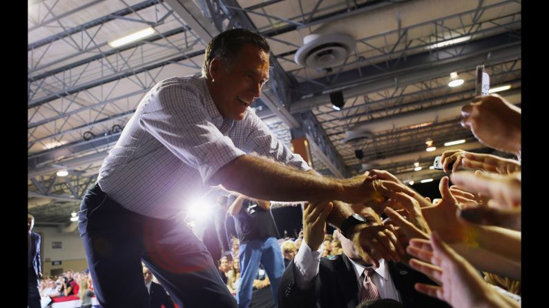 Romney shakes hands with supporters during the Juntos Con Romney Rally in Miami on Wednesday.