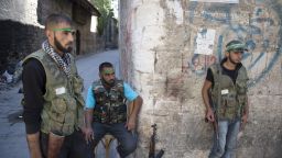 Syrian rebel fighters keep their position at a checkpoint in the Old City of Aleppo on September 20, 2012