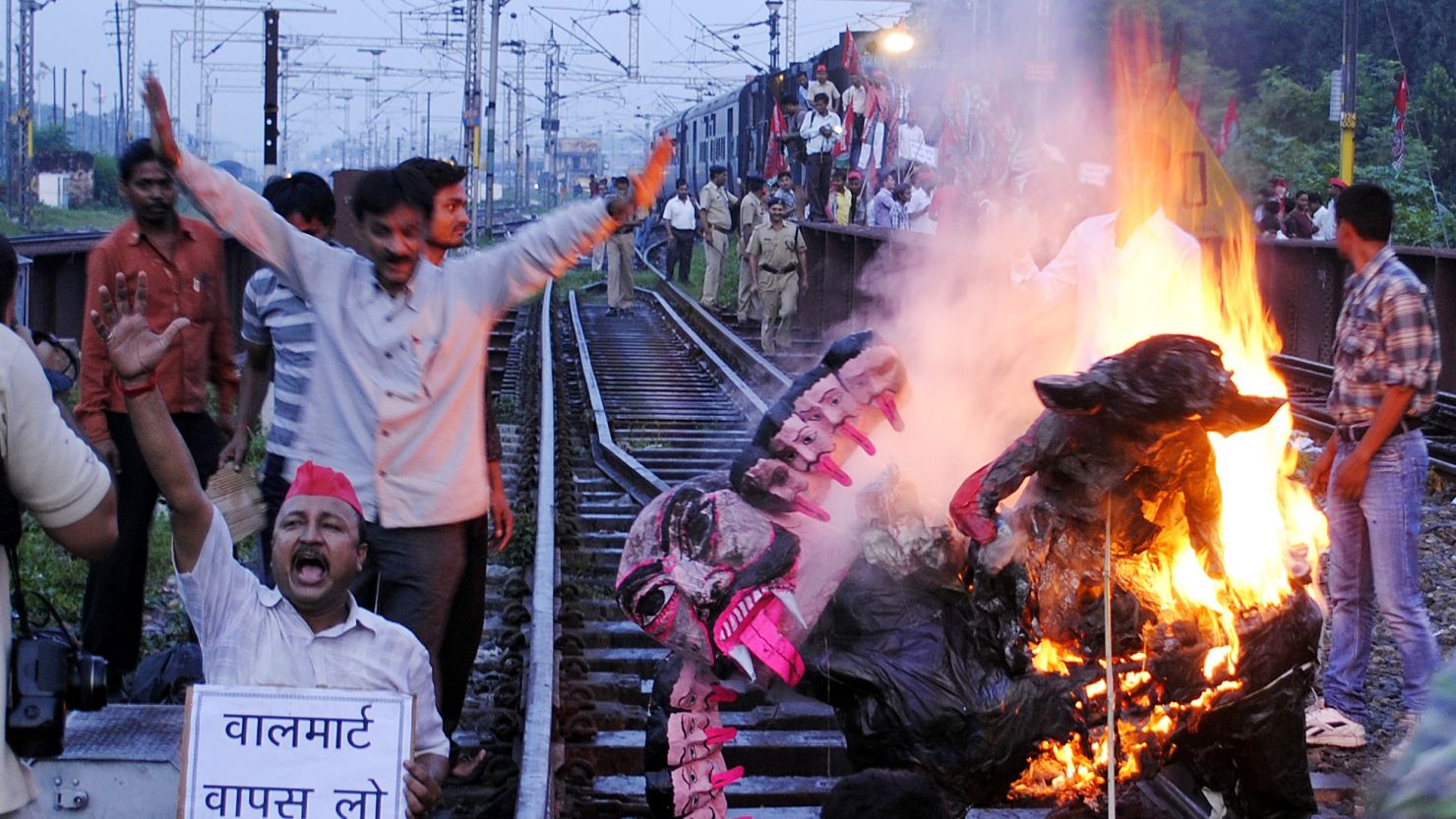 Samajwadi Party workers stop a train in Allahabad on September 20, 2012 in protest at the government's retail reforms.